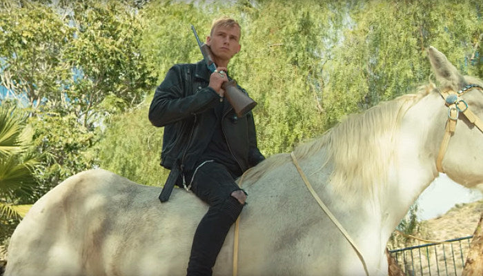 Machine Gun Kelly on a horse